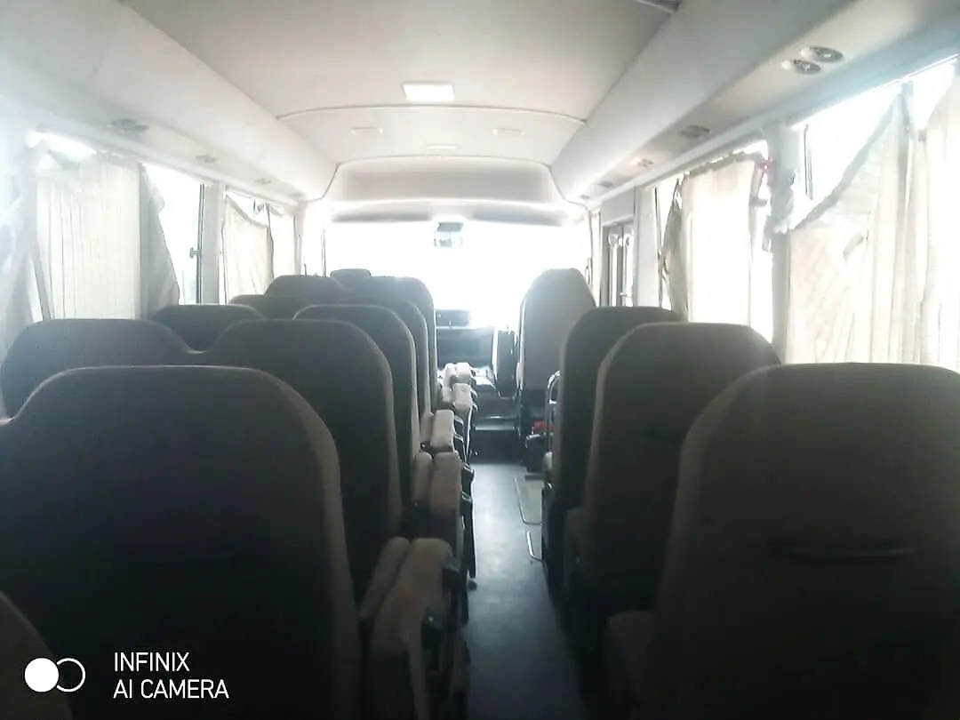 Interior aisle of the Toyota Coaster platform used for the armoured Coaster rental
