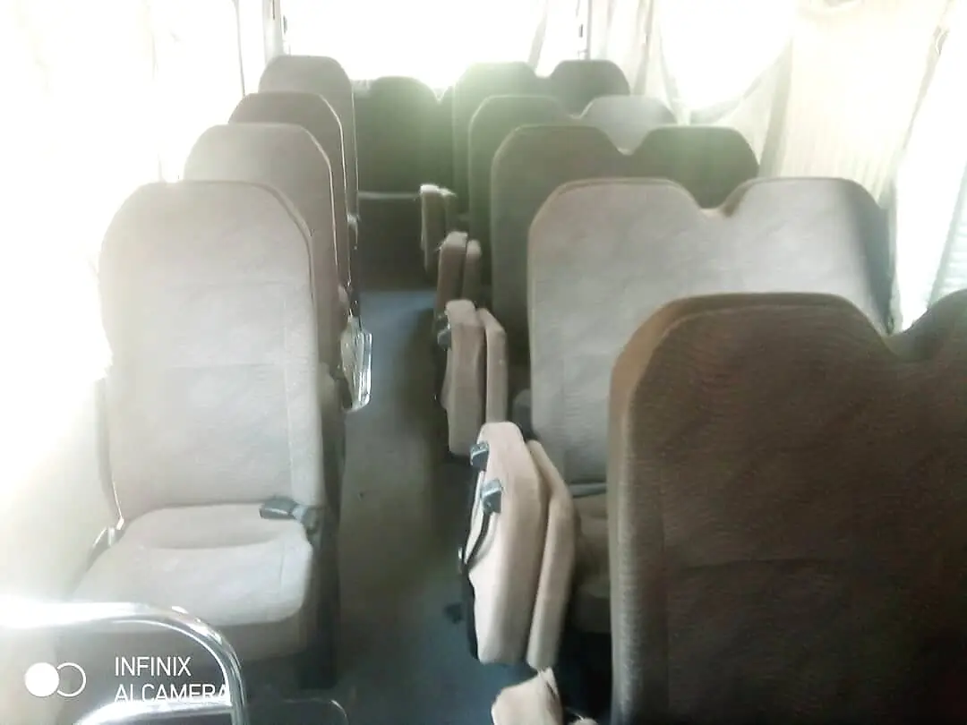View toward the rear of the Coaster bus from the front seats