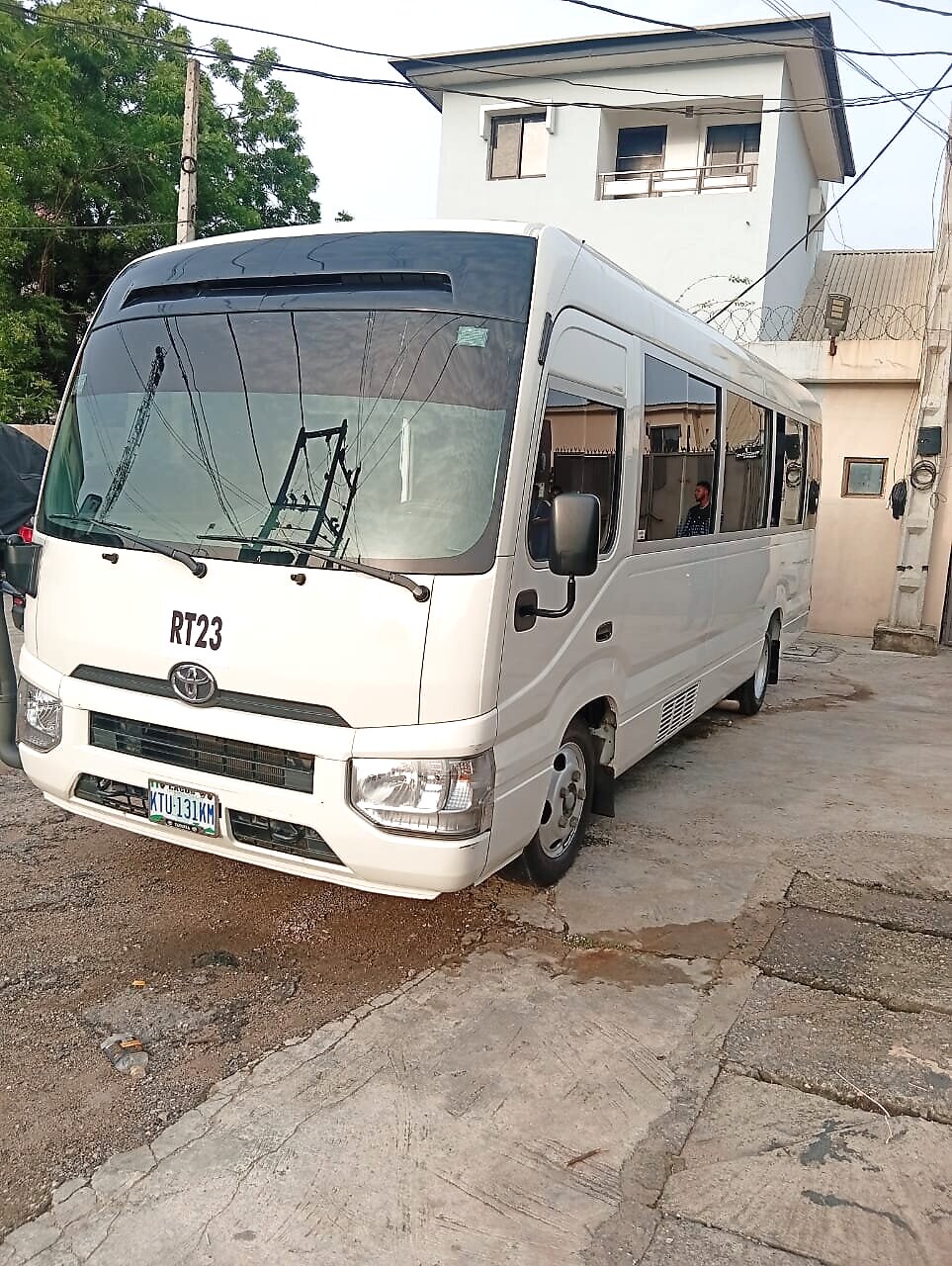 Coaster and Hiace buses available for bus rental in Ikeja, Lagos - front and side view