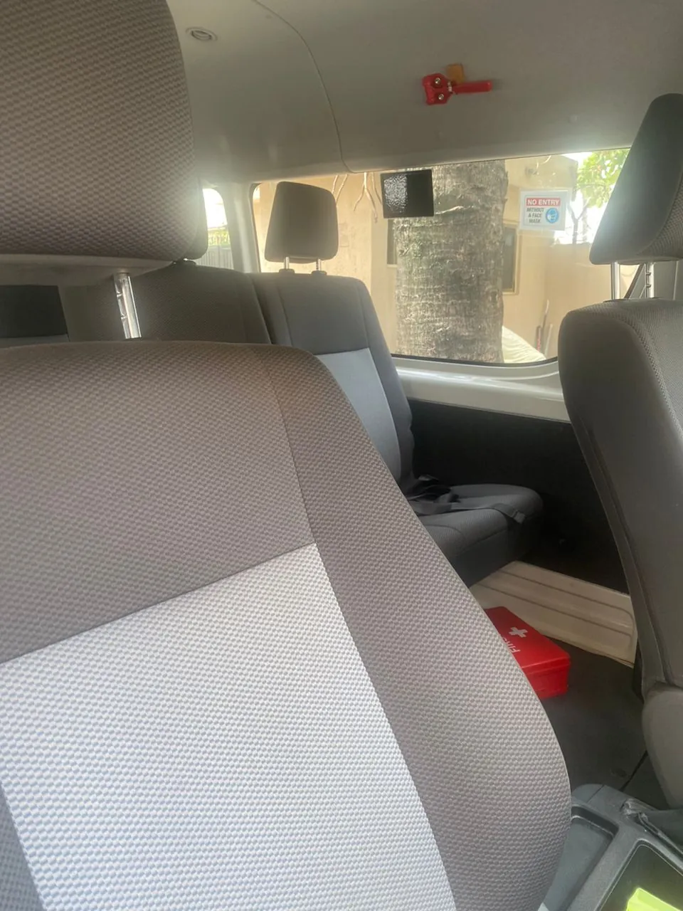 Toyota Hiace interior with grey cloth passenger seats and headrests