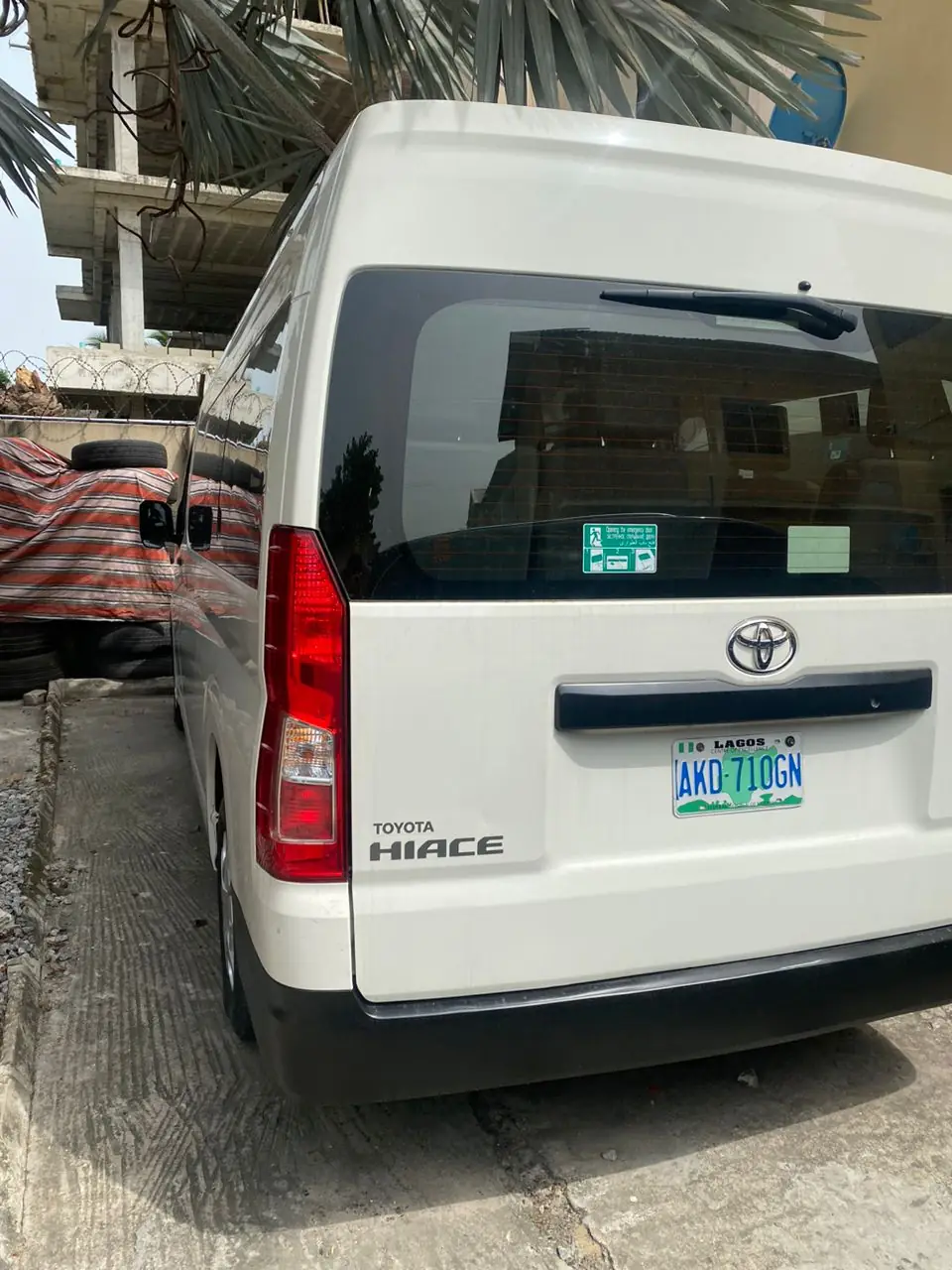 Rear view of a white Toyota Hiace showing the Hiace badge and Lagos number plate